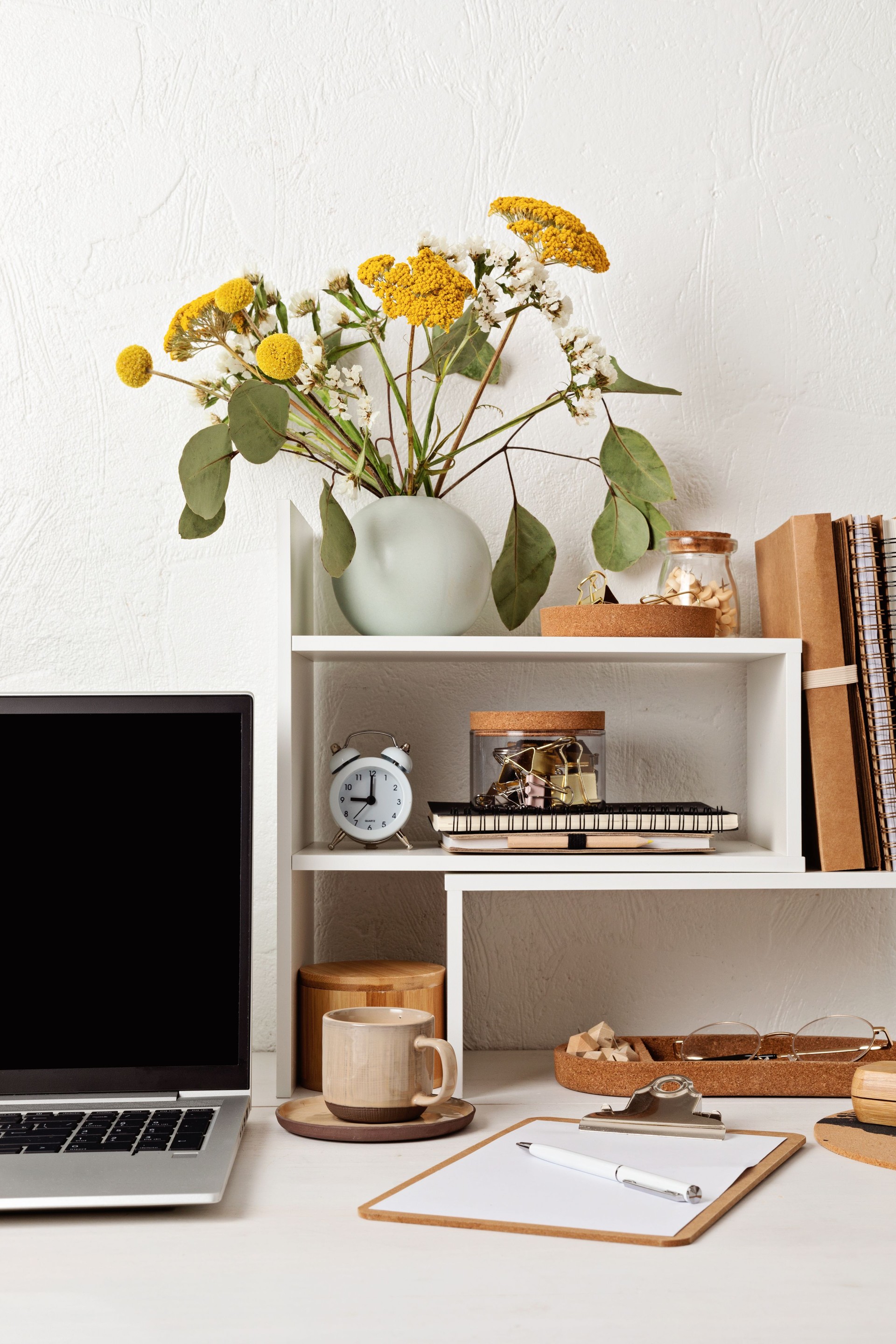 Empty laptop screen, desktop organizer with desk shelves and office supplies. Back to school, home office, begining of studies concept. Mockup, template